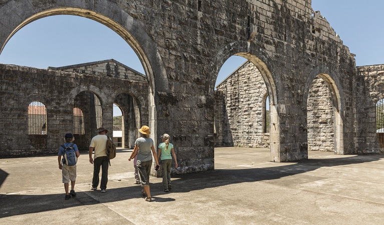 A family walking through an archway at Trial Bay Gaol in Arakoon National Park. Photo: David Finnegan/DPIE