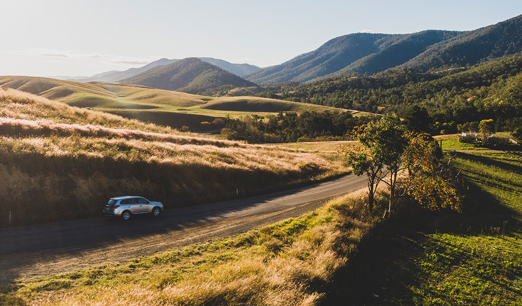 A car pictured driving along the scenic Thunderbolts Way, outside of Gloucester. Credit: Guy Williment  © Destination NSW