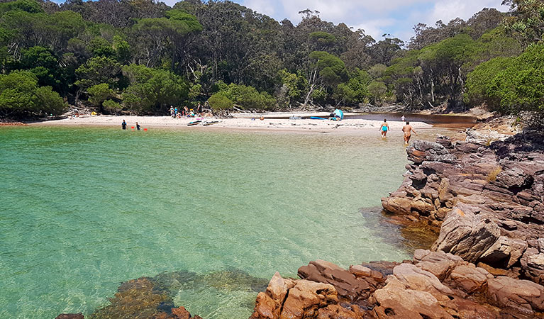 People swimming and paddling at Bittangabee Bay in summer. Photo: Amanda Cutlack/OEH