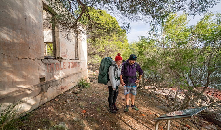 Bushwalkers at ruins near Bittangabee campground in Beowa National Park. Photo: John Spencer/OEH