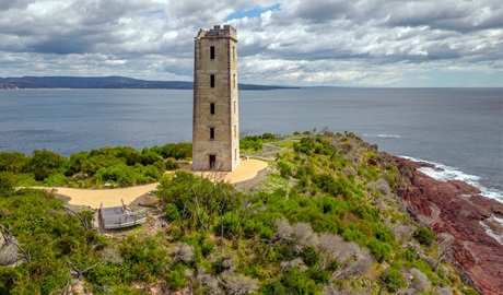 Boyds Tower with missing section where it was struck by lightning, Beowa National Park near Eden. Photo: John Spencer, &copy; DCCEEW