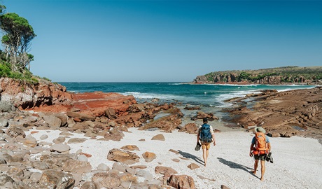 Hikers arriving at Hegartys Bay, a small rocky beach. Credit: Remy Brand/DCCEEW &copy; Remy Brand