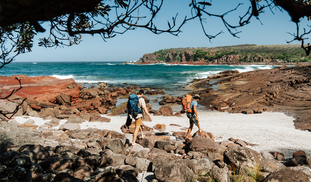 Walkers at Leather Jacket Bay, Beowa National Park near Eden. Photo: Remy Brand, &copy; Caravel Content