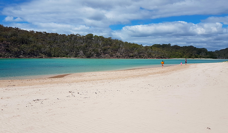 Family walking along the sand bank of Pambula River in Beowa National Park. Photo &copy; Amanda Cutlack