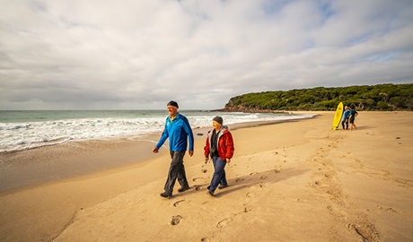 Bush walkers and surfers at Saltwater Creek campground, Beowa National Park. Photo: John Spencer &copy; OEH