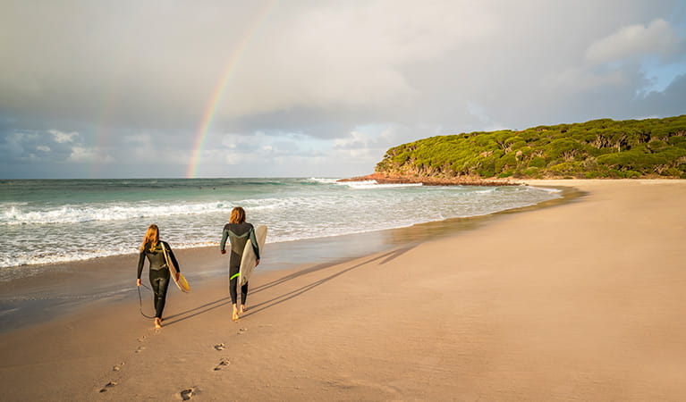 Surfers on the beach at Saltwater Creek campground, Beowa National Park. Photo: John Spencer/OEH