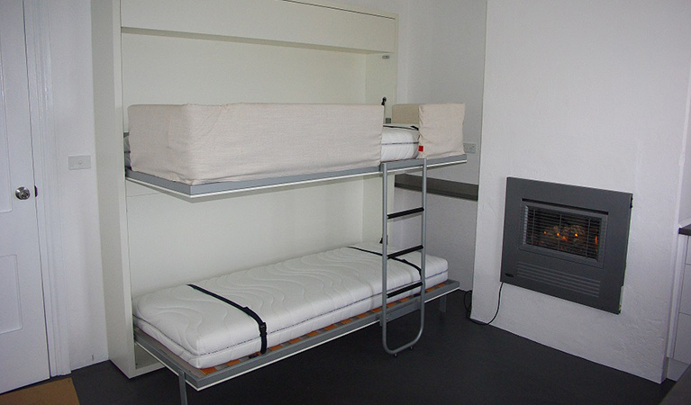 Bunk beds in the kitchen area of Telegraph Station bunkhouse in Beowa National Park. Photo: Gary Mullinger/OEH