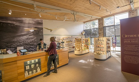 A visitor talks to staff at Blue Mountains Heritage Centre, Blue Mountains National Park. Photo: John Spencer/OEH