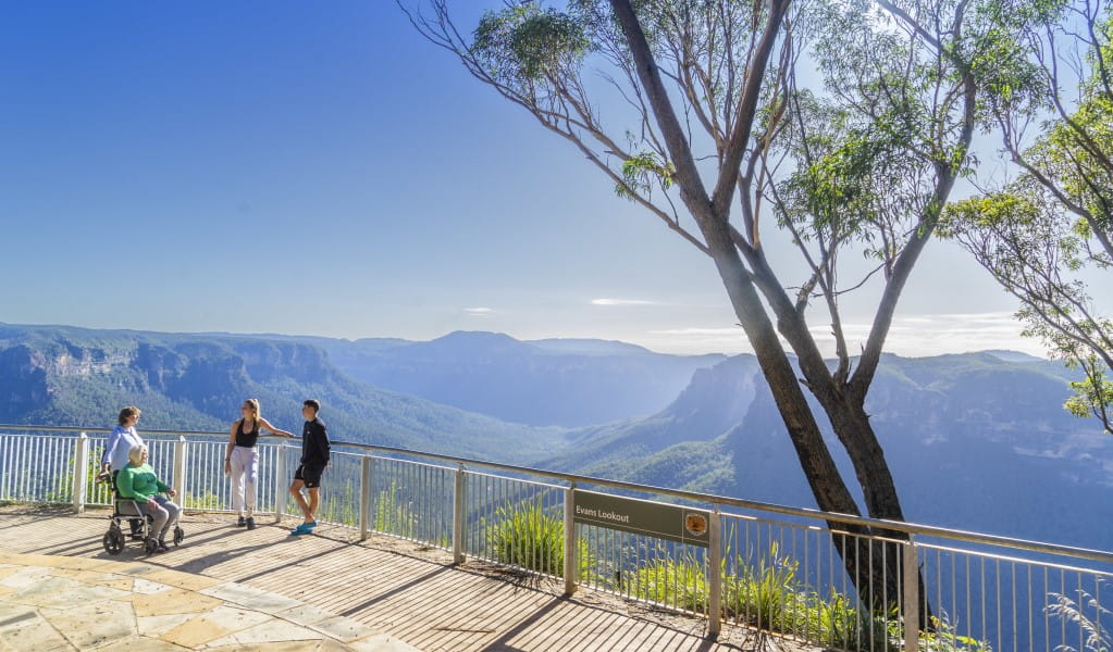 Visitors take in the views from Evans lookout, Blue Mountains National Park. Photo: Simone Cottrell/OEH