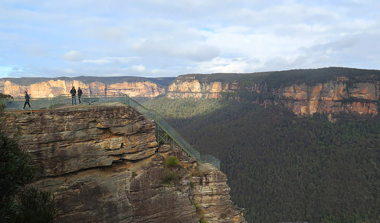 Three people at Pulpit Rock lookout's lower viewpoint, Blue Mountains National Park. Photo: E Sheargold/OEH.