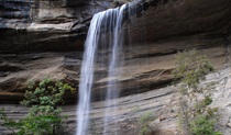 Water cascades over a rock ledge onto boulders at Victoria Falls, in Blue Mountains National Park. Photo: Stephen Alton &copy; DPIE