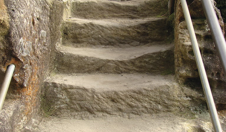 Close up view of steps hewn into solid rock, showing wear from use. Photo: Stephen Alton &copy; OEH