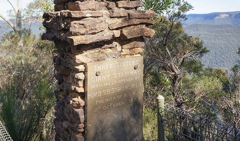 A historic plaque on a stonework pillar commemorates the Giant Stairway's 1932 opening.  Photo: Stephen Alton &copy; OEH