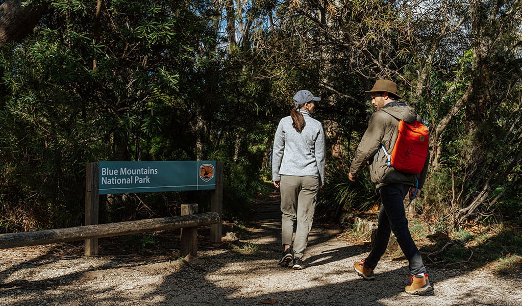 2 walkers on Grand Cliff Top Walk entering Blue Mountains National Park at Gordon Falls Reserve. Photo: Remy Brand © Remy Brand