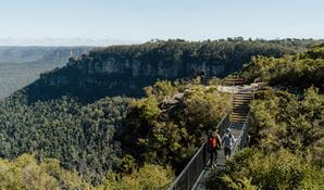 2 walkers crossing Buttenshaw Bridge on Grand Cliff Top Walk, Greater Blue Mountains Heritage Area. Photo: Remy Brand &copy; Remy Brand
