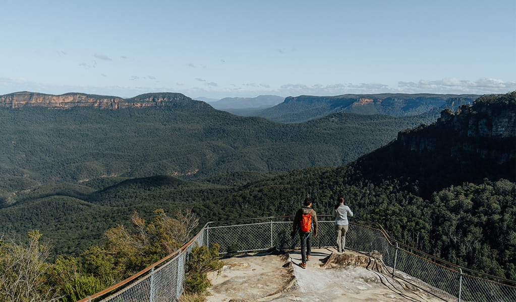 2 walkers admiring the view from Elysian lookout on Grand Cliff Top Walk, Greater Blue Mountains Heritage Area. Photo: Remy Brand &copy; Remy Brand