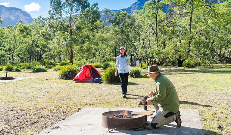 Campers use fire ring facilities at Kedumba River crossing campground, Blue Mountains National Park. Photo: Simone Cottrell/OEH