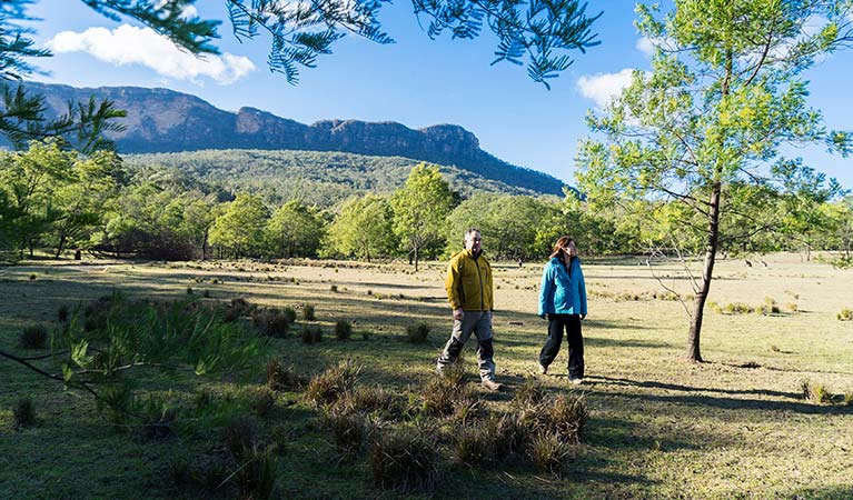 A couple bushwalk near Kedumba River Crossing campground, Blue Mountains National Park. Photo: Simone Cottrell/OEH