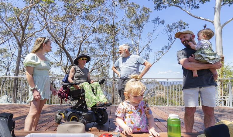 Visitors enjoying a day out at the scenic Valley of the Waters lookout, in the Katoomba area of Blue Mountains National Park. Photo: Simone Cottrell © DPE
