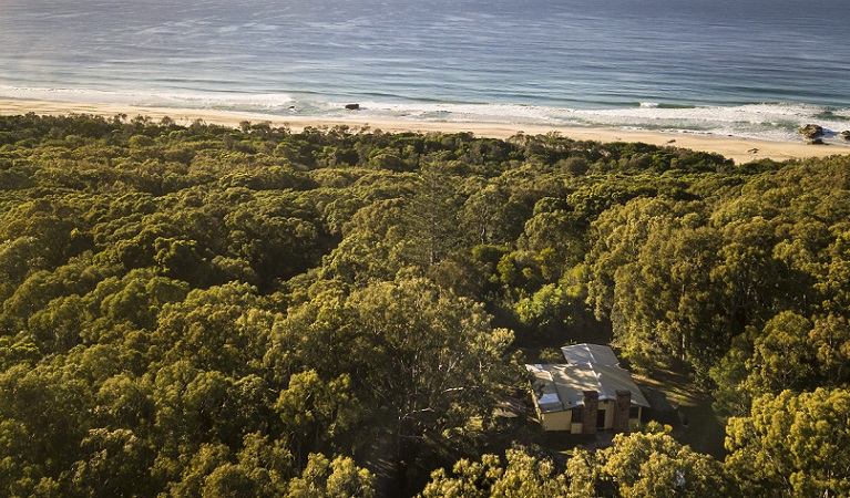 Aerial view of Tuckers Rocks Cottage and bushland and beach surrounds. Photo: John Spencer/DPIE