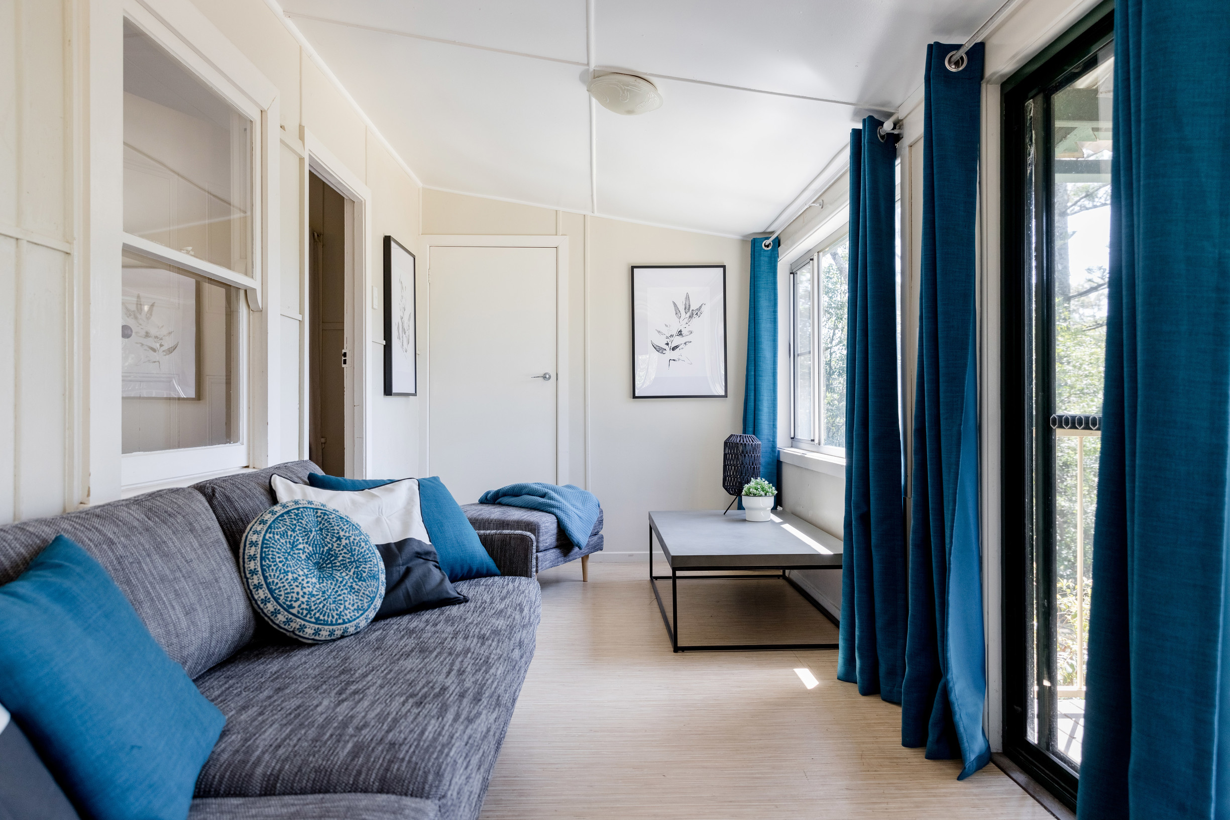 The sunroom with sofa bed in Tuckers Rocks Cottage, Bongil Bongil National Park. Photo: Mitchell Franzi/DPIE