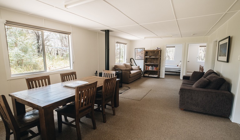 Lounge and dining area, Robinsons Cabin in Boonoo Boonoo National Park. Photo credit: Harrison Candlin &copy; Harrison Candlin