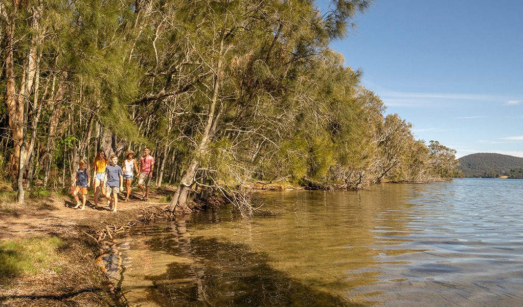 A group walks along Booti walking track beside Wallis Lake, in Booti Booti National Park. Credit: John Spencer &copy; DPE