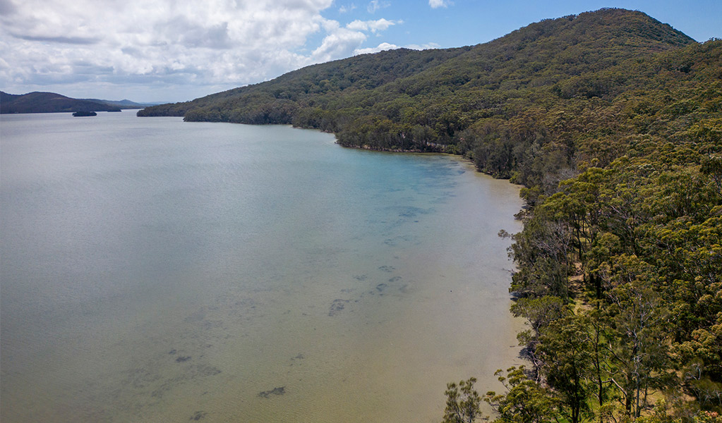 An aerial view of Sunset picnic area on the shores of Wallis Lake. Credit: John Spencer &copy; DPE