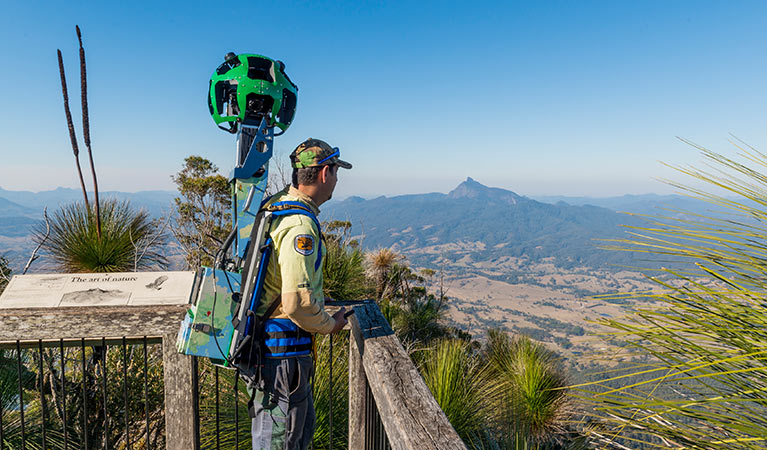 A man carrying Google Trekker equipment at Pinnacle lookout in Border Ranges National Park. Photo credit: John Spencer &copy; OEH