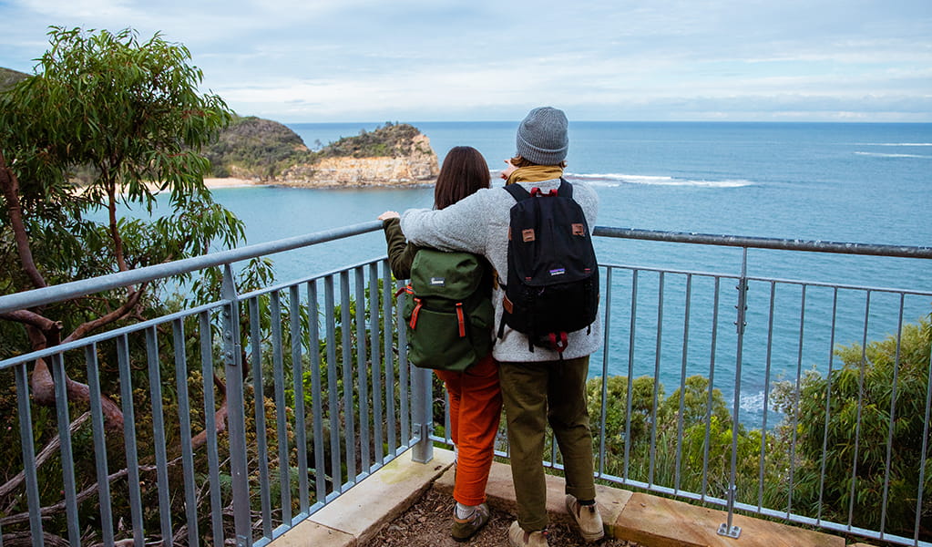 A couple at a lookout on Bouddi costal walk admiring ocean views. Photo:  Jared Lyons &copy; DPE