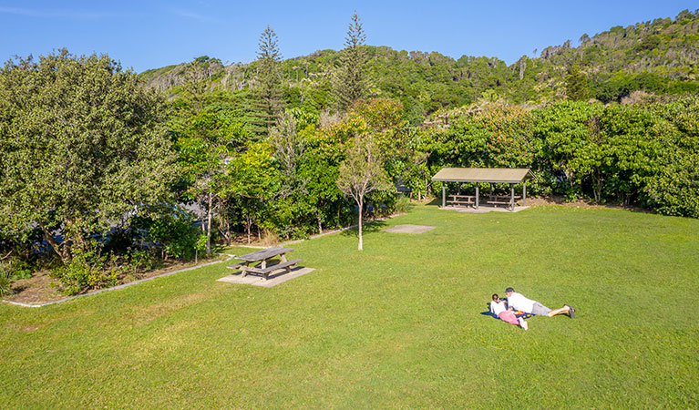 Aerial view of picnickers and picnic tables at Broken Head picnic area in Broken Head Nature Reserve. Photo: John Spencer/DPIE