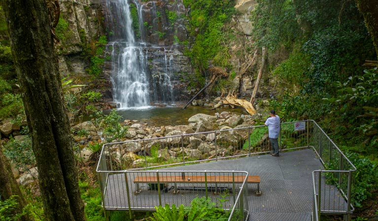 A man stands at a viewing platform at Minnamurra Falls, Budderoo National Park. Photo credit: John Spencer &copy; DPIE