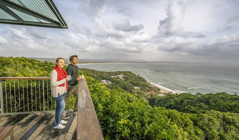 Visitors taking in the view over Byron Bay from Cape Byron Lighthouse Cafe. Photo: John Spencer/OEH