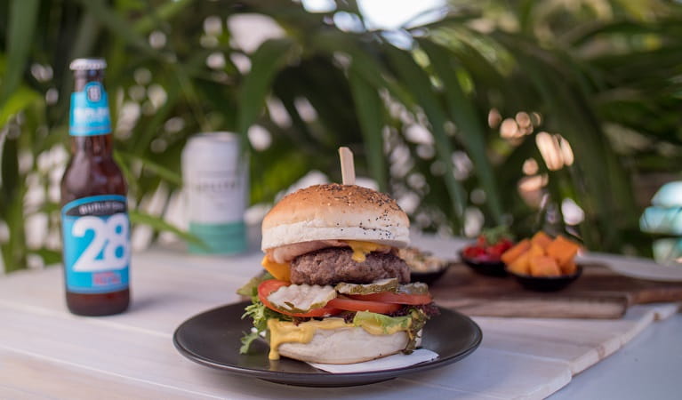 Burger on the menu at The Pass Cafe, Cape Byron State Conservation Area. Photo: Kyle James Healy