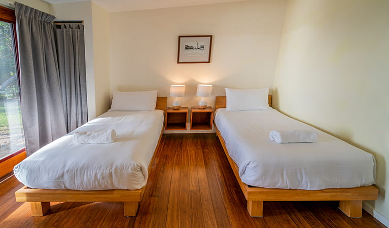Two single beds in a guest room at Mildenhall cottage. Photo: DPIE/John Spencer
