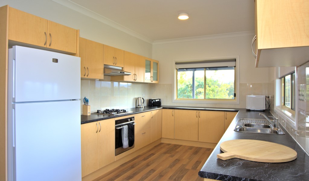 The fully-equipped kitchen in Honeyeater Homestead, Capertee National Park. Photo: Steve Garland &copy; DPE