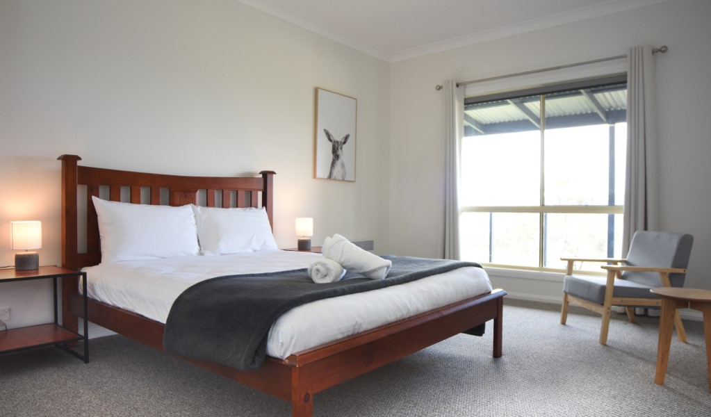 A bedroom with queen bed in Honeyeater Homestead, Capertee National Park. Photo: Steve Garland &copy; DPE