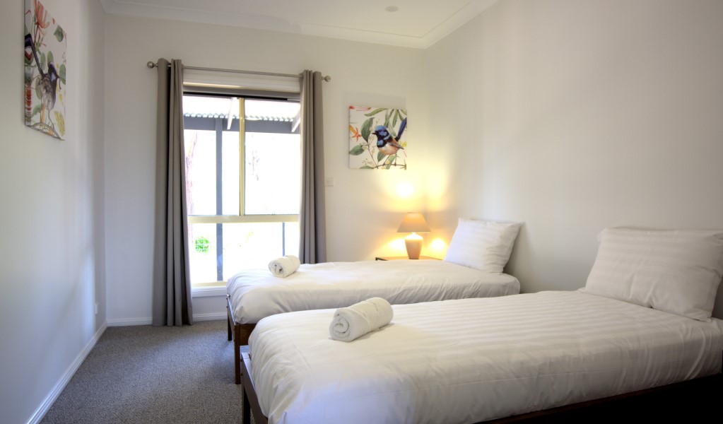 A bedroom with 2 single beds in Honeyeater Homestead, Capertee National Park. Photo: Steve Garland &copy; DPE