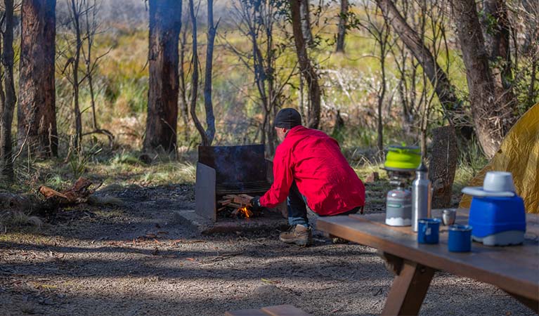 A camper lighting a bbq at Barokee campground, Cathedral Rock National Park. Photo: Josh Smith &copy; DPE