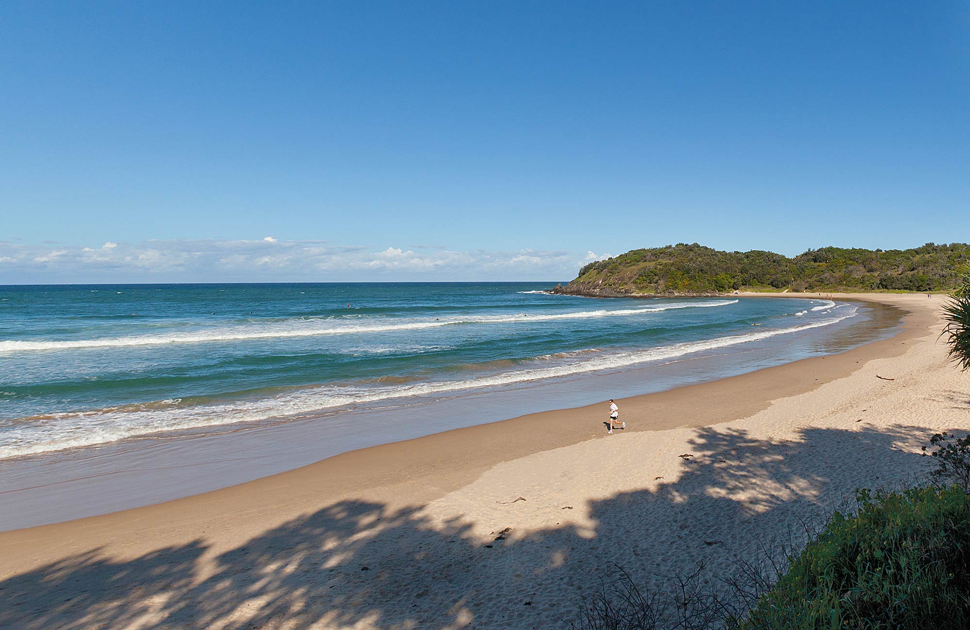 A person running along diggers beach. Photo: Rob Cleary 