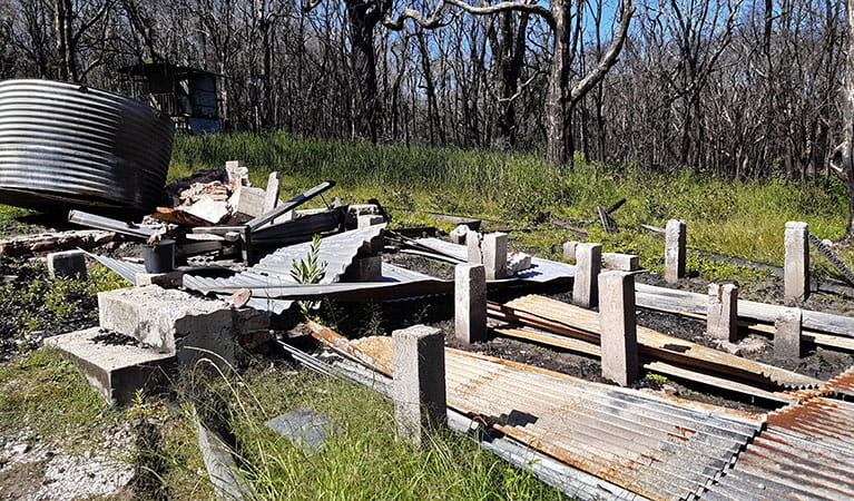 The foundations of Kylies Hut after it was destroyed by bushfire in 2019. Photo: Elizabeth Jude &copy; DPIE