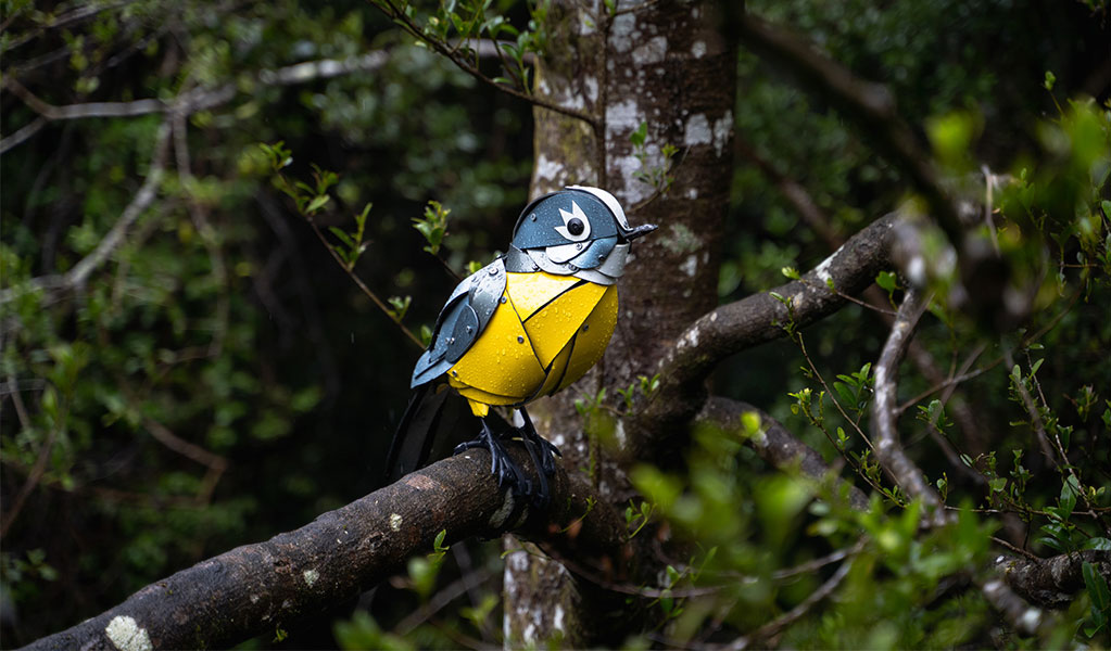 A sculpture of a bird perched on a branch along the Walk with the birds boardwalk in Dorrigo National Park. Credit: Jay Black &copy: DCCEEW