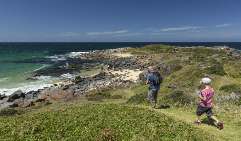 A father and son walking towards the beach at Bingi Bingi Point in Eurobodalla National Park. Photo: David Finnegan &copy; OEH