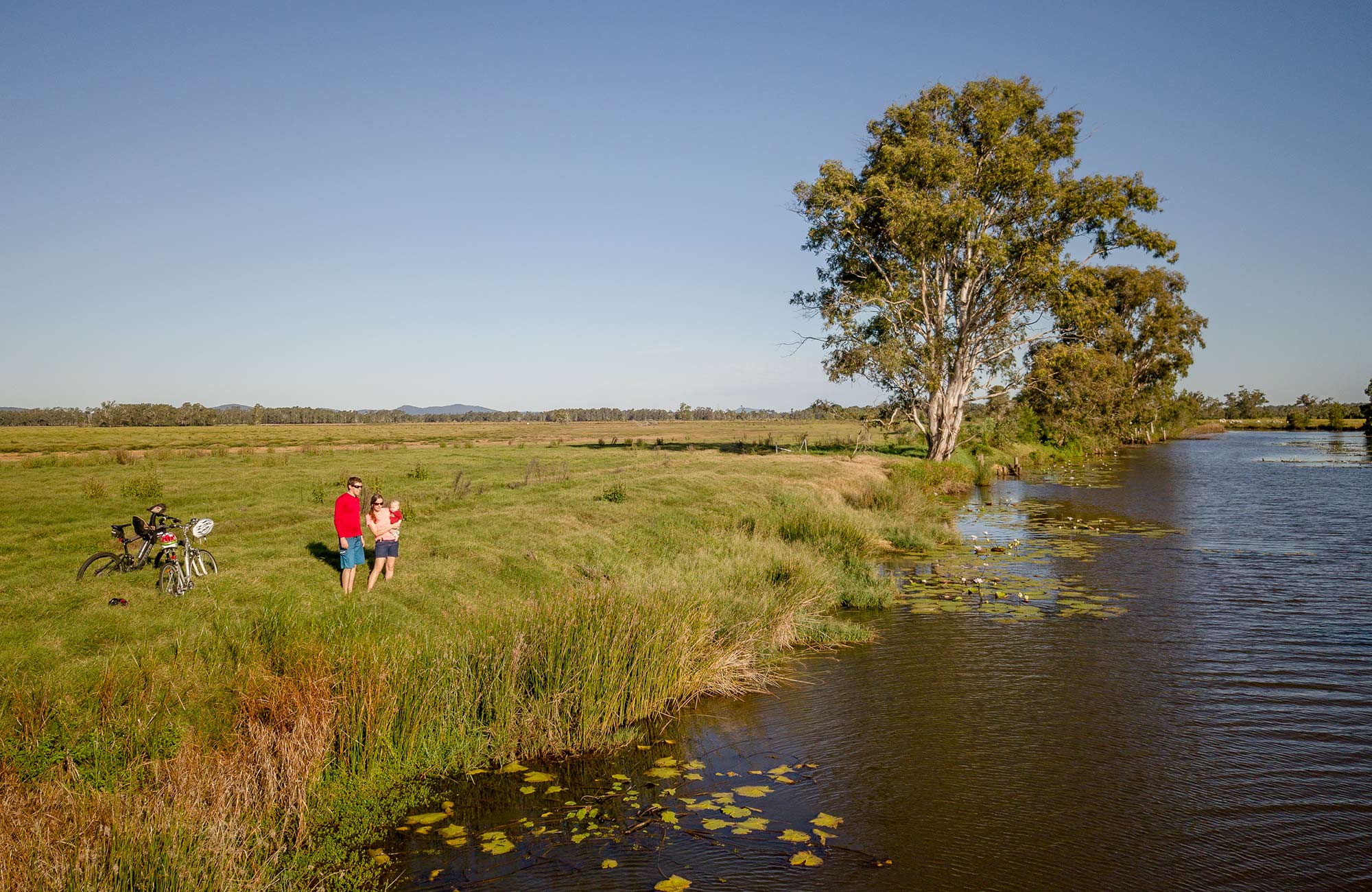 Family on the banks of Woody Creek in Everlasting Swamp National Park. Photo: John Spencer/OEH