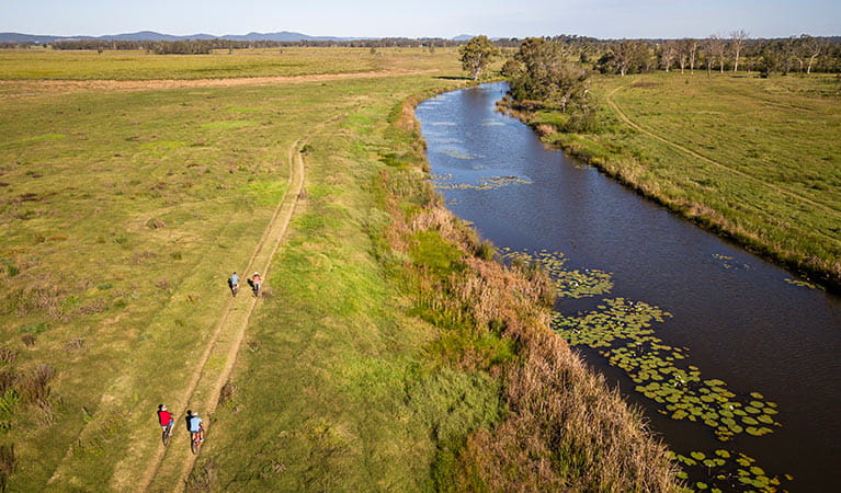 Group cycling along Woody Creek in Everlasting Swamp National Park. Photo: John Spencer/OEH