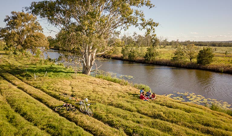 Group of friends picnicking on the banks of Woody Creek. Photo: John Spencer/OEH