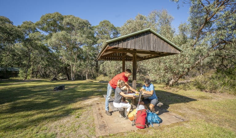 A family planning their day out at Dandahra picnic area in Gibraltar Range National Park. Photo: John Spencer &copy; DPIE