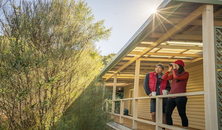 Visitors looking out from the deck at Gibralter House. Photo: John Spencer/OEH