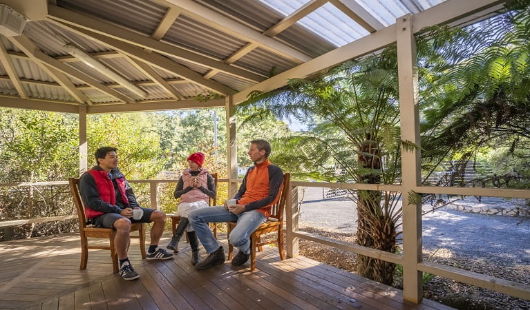 Visitors enjoying a cuppa on the deck at Gibralter House. Photo: John Spencer/OEH
