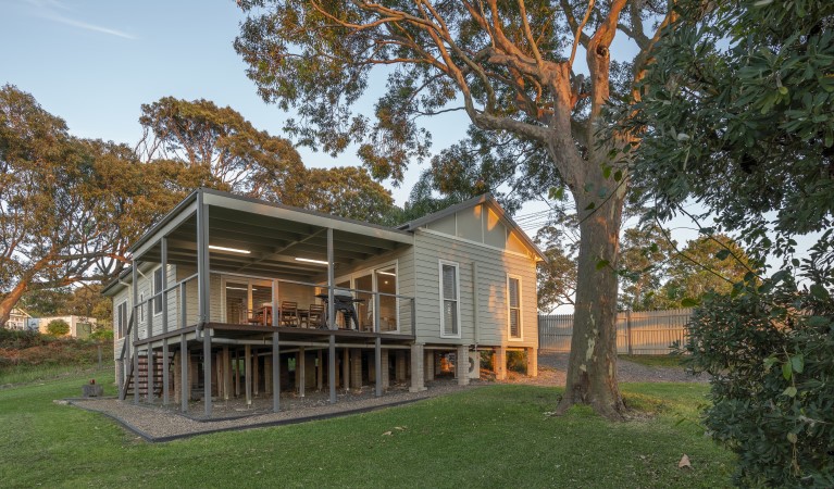 The exterior of Baileys Cottage surrounded by trees in Glenrock State Conservation Area. Photo: John Spencer &copy; DPIE